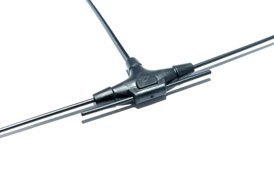 Close-up of a metal rod with a black connector on a white background